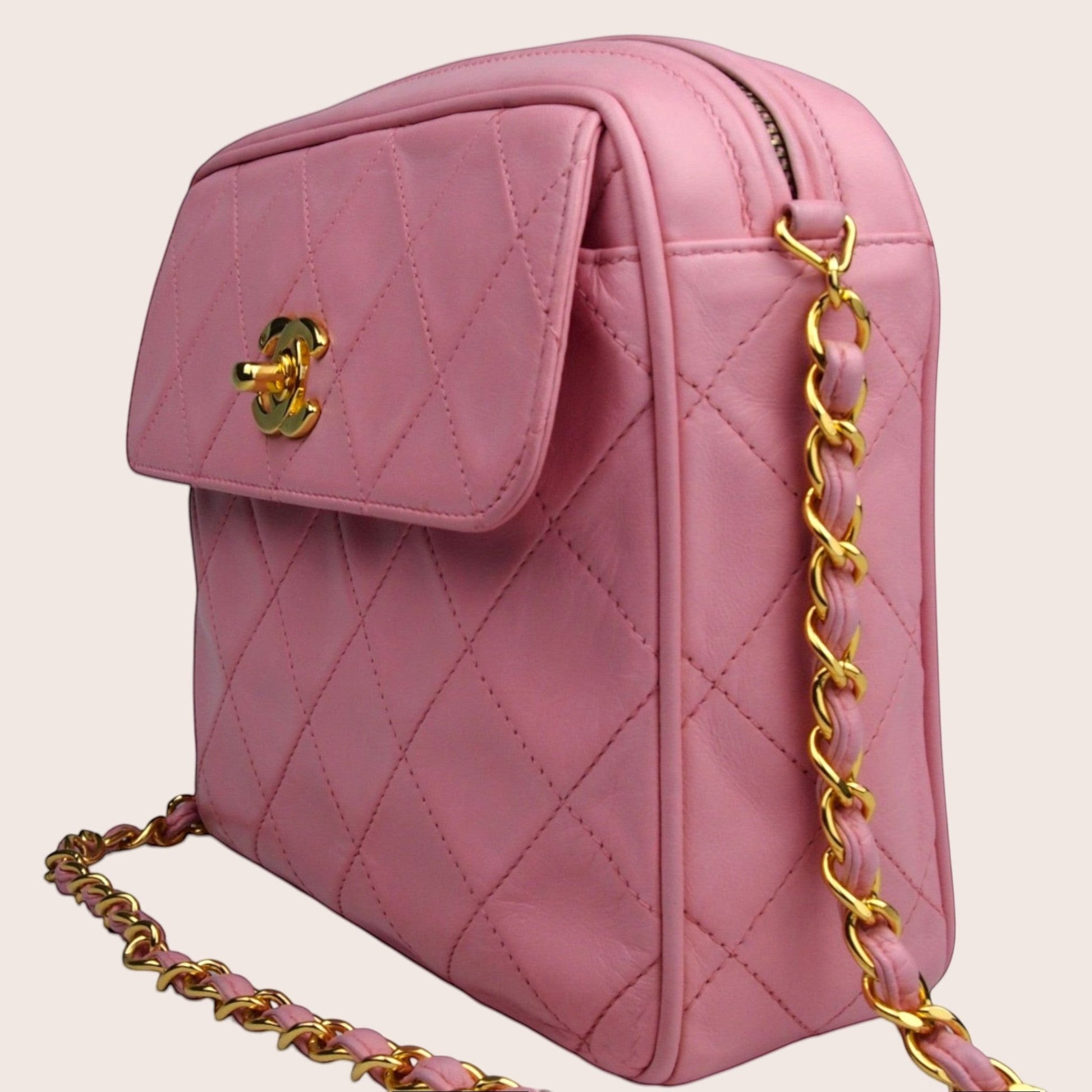 Nandalee pink quilted lambskin Chanel camera bag with gold hardware and chain strap.