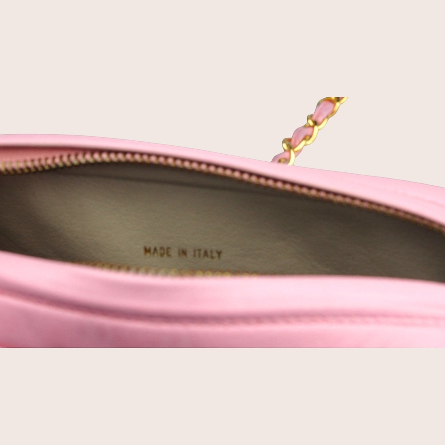 Nandalee pink leather Chanel camera bag with gold chain detail and tassel.