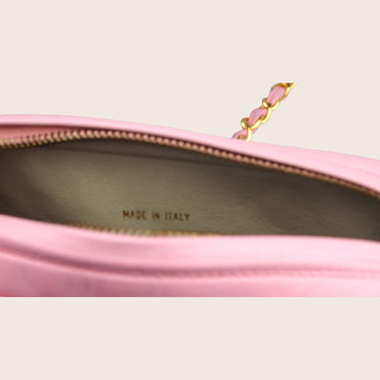 Nandalee pink leather Chanel camera bag with gold chain detail and tassel.