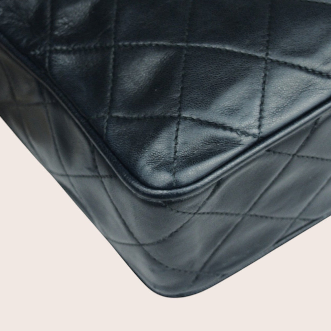 Nandalee black lambskin Chanel Single Flap vintage camera bag with gold chain strap and diamond quilting.