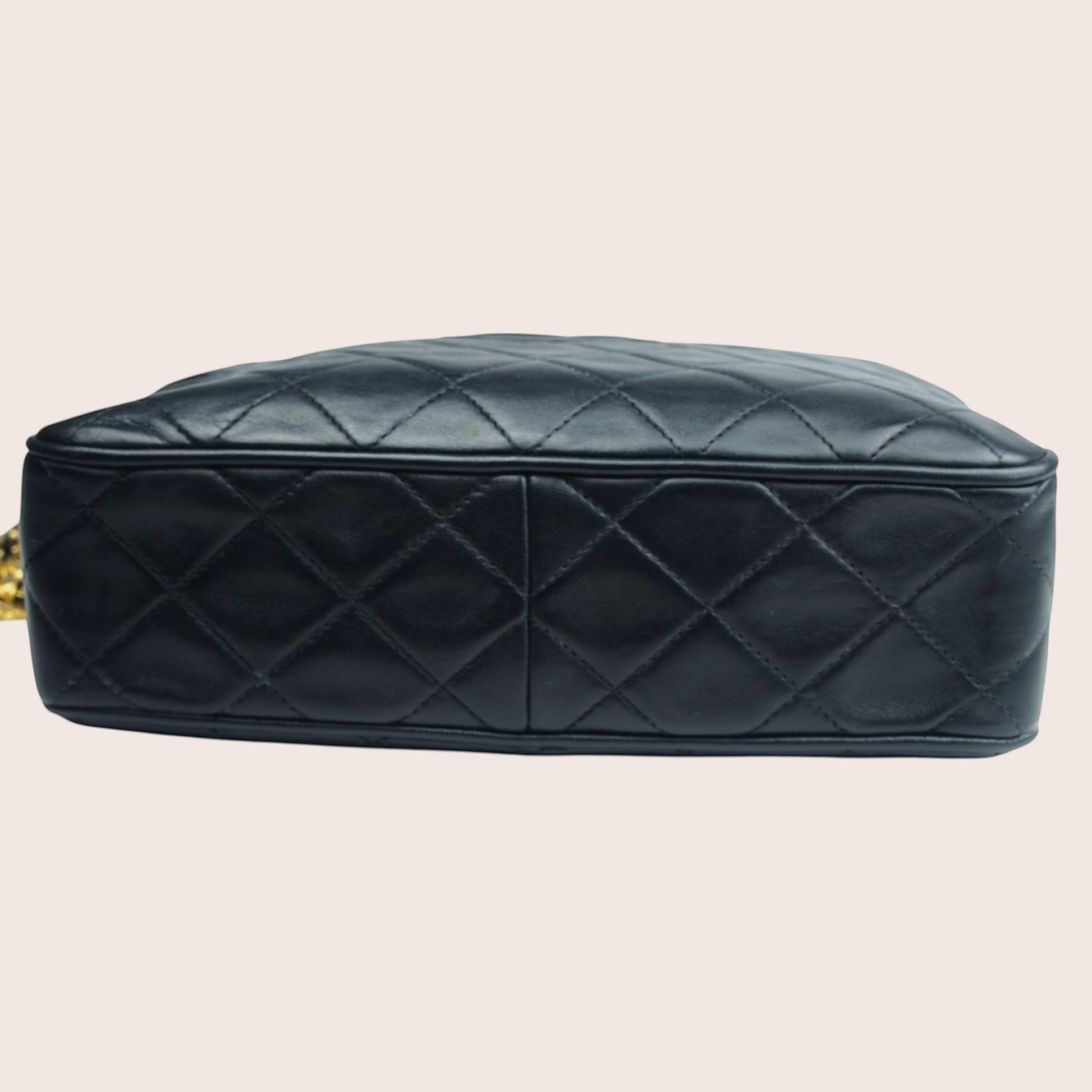 Nandalee black lambskin Chanel Single Flap vintage camera bag with gold chain strap and diamond quilting.