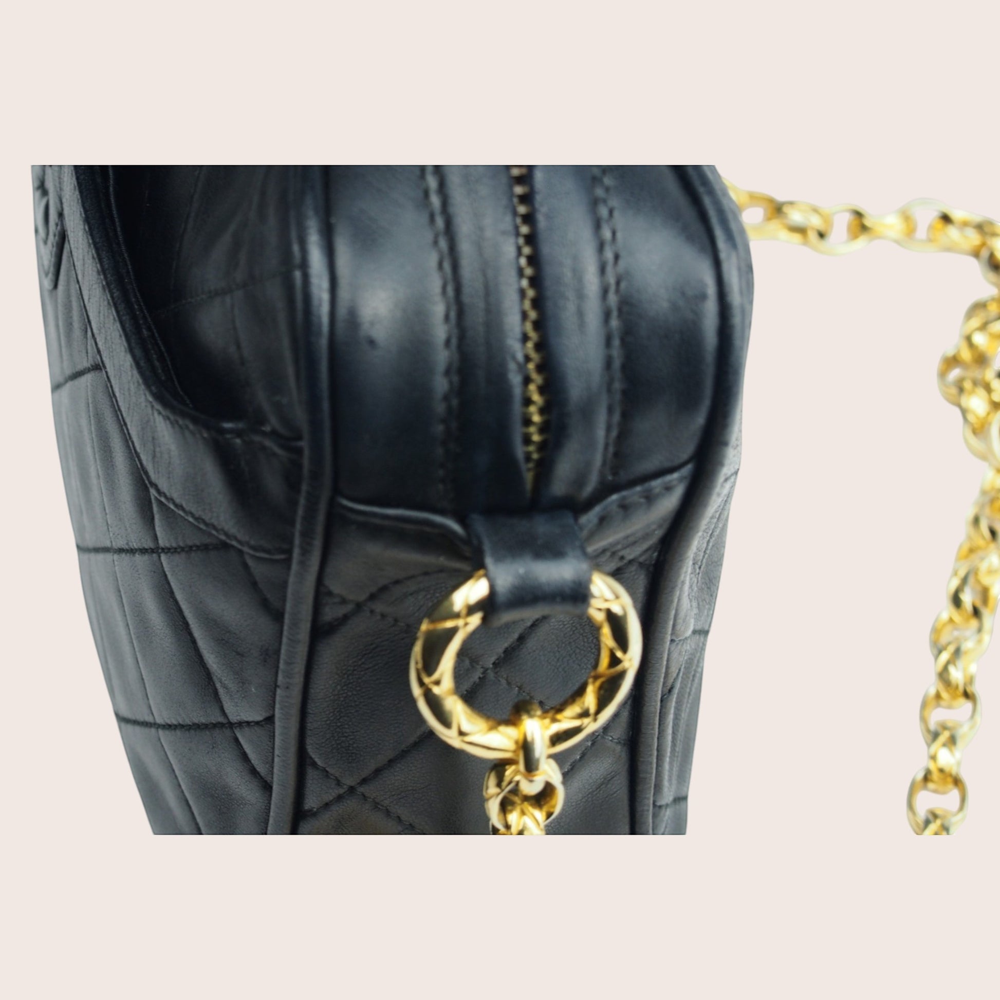 Nandalee black lambskin Chanel Single Flap vintage camera bag with gold chain strap and diamond quilting.