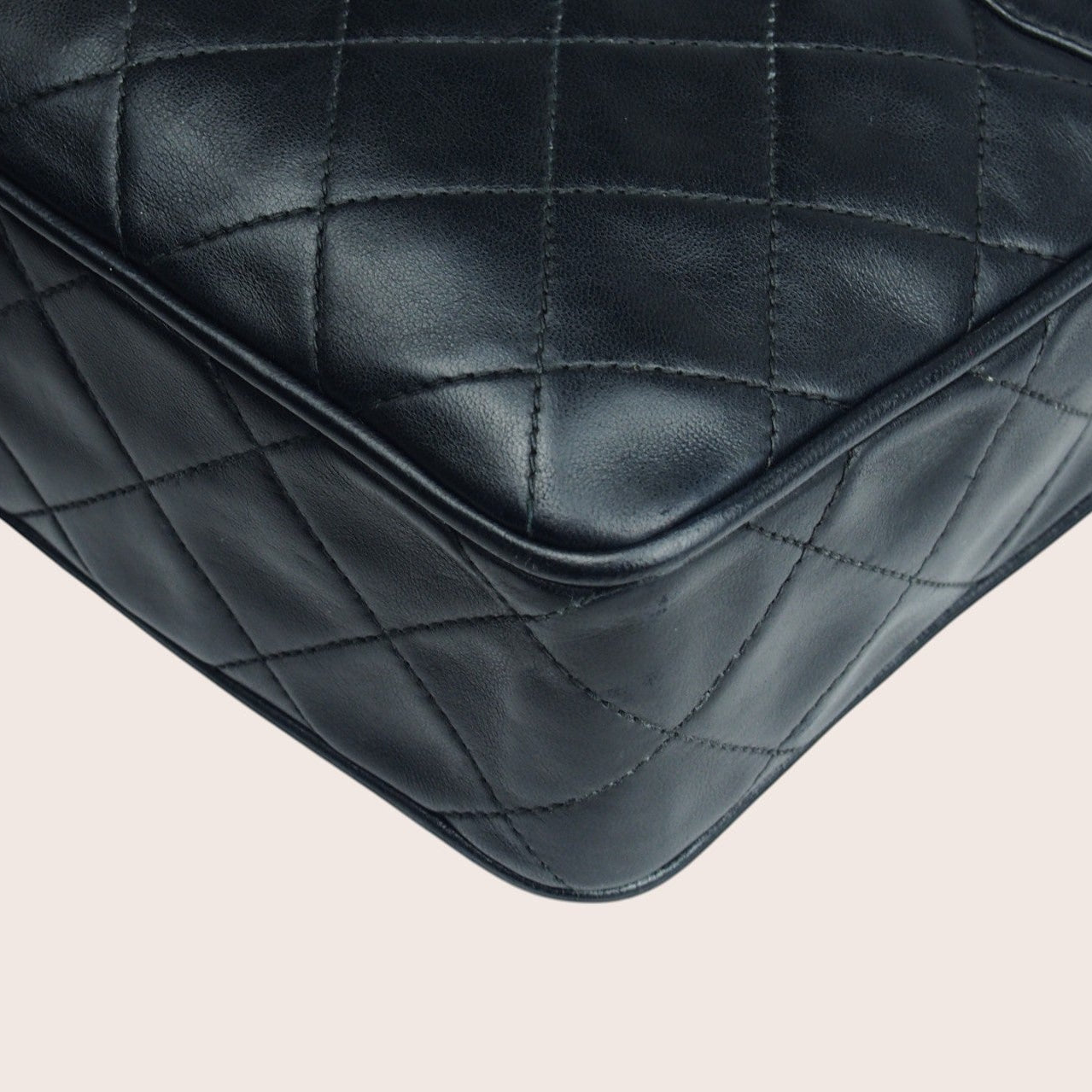 Nandalee black lambskin leather Chanel Single Flap vintage camera bag with gold hardware and diamond quilting.