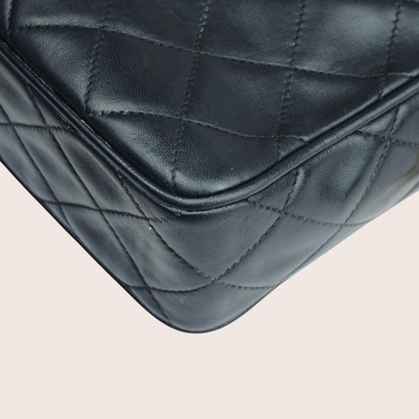 Nandalee black lambskin leather Chanel Single Flap vintage camera bag with gold hardware and diamond quilting.